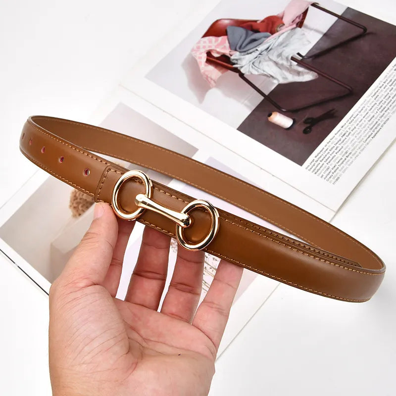 Women's caramel leather belt with an elegant zinc alloy Celtic knot buckle, perfect fashion accessory for dresses.