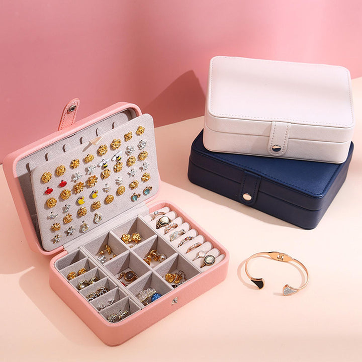 Sophisticated flip-top jewelry storage box, perfect for rings, earrings, and necklaces.