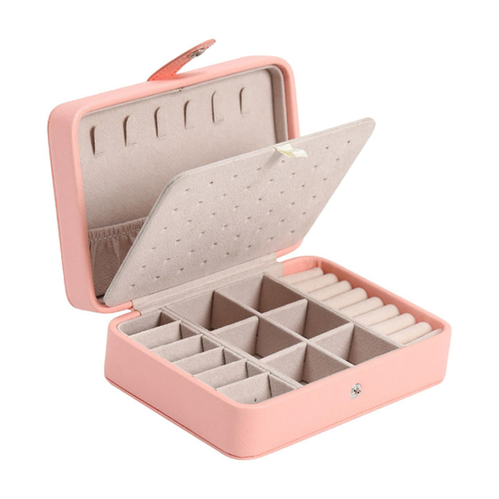 Elegant pink leather flip-top jewelry box for women's organized storage and vanity.