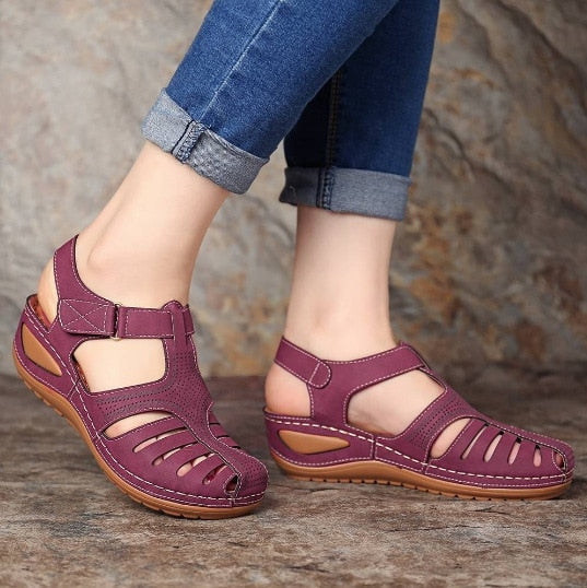Stylish women's closed toe wedge sandals offering orthopedic support and comfort.