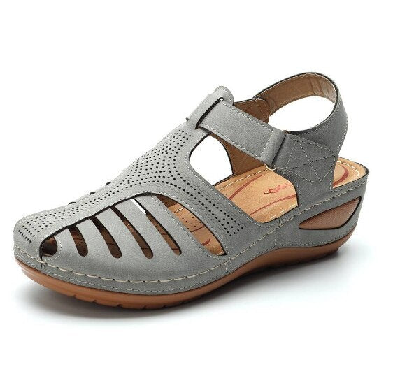Supportive women's orthopedic wedge footwear, featuring a secure closed toe and adjustable fit.