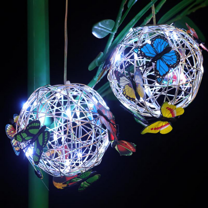 Decorative SolarGlow butterfly LED light for home garden, casting a warm glow, eco-friendly & automatic patio lamp.