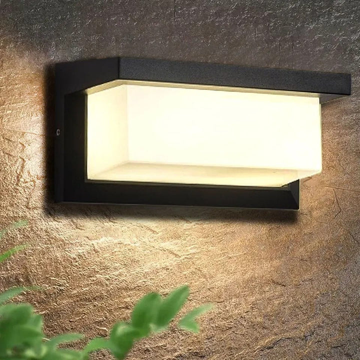 Modern smart motion sensor outdoor LED wall light, perfect for porch or patio security, weatherproof & energy-efficient.