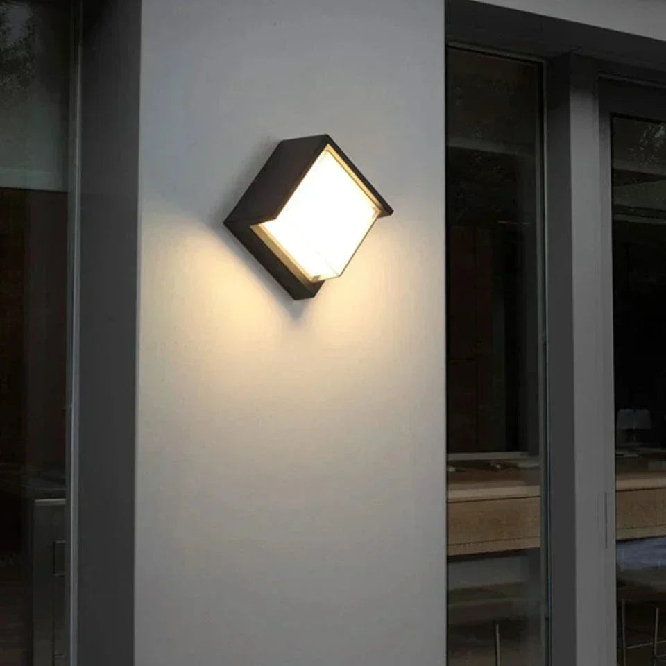 Weatherproof exterior LED wall light with motion sensor, ideal for patio, porch or garden, energy-efficient security.