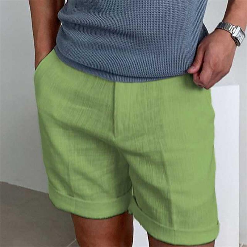 Refined men's linen shorts featuring a stylish rolled cuff, perfect for summer fashion.