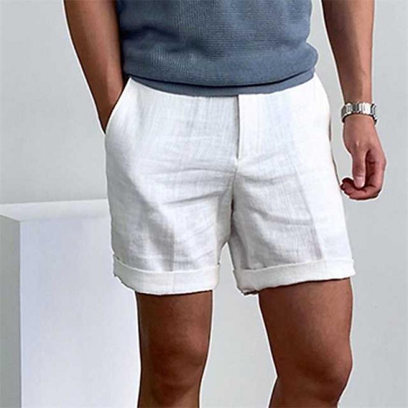 Comfortable men's linen beach shorts with rolled cuffs, ideal for warm weather style.