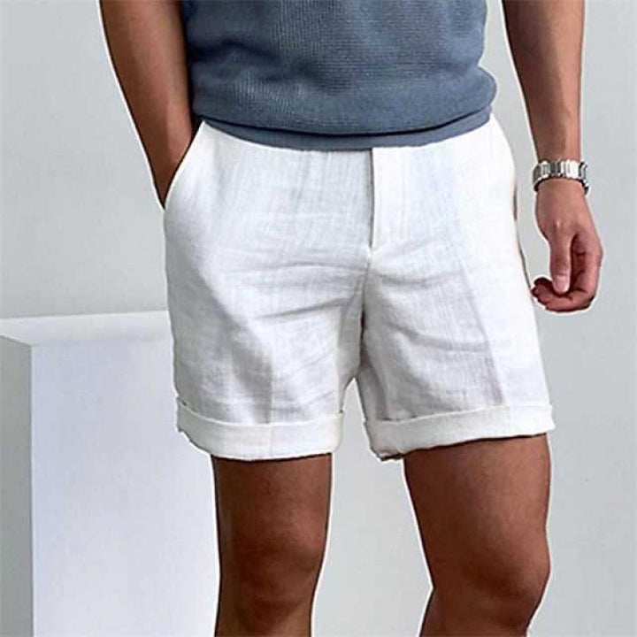 Comfortable men's linen beach shorts with rolled cuffs, ideal for warm weather style.