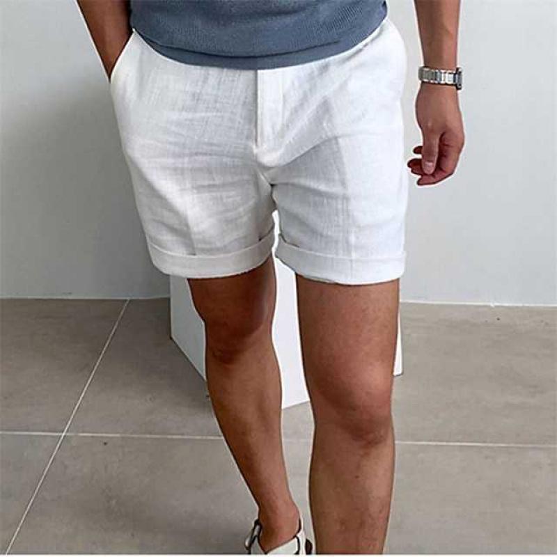 Tailored men's linen shorts with polished rolled cuffs for a versatile summer fashion look.