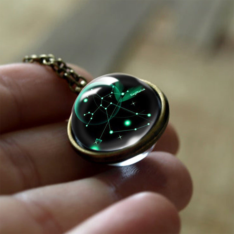 Detailed close-up of a Leo zodiac glass pendant necklace, spiritual protection for women.