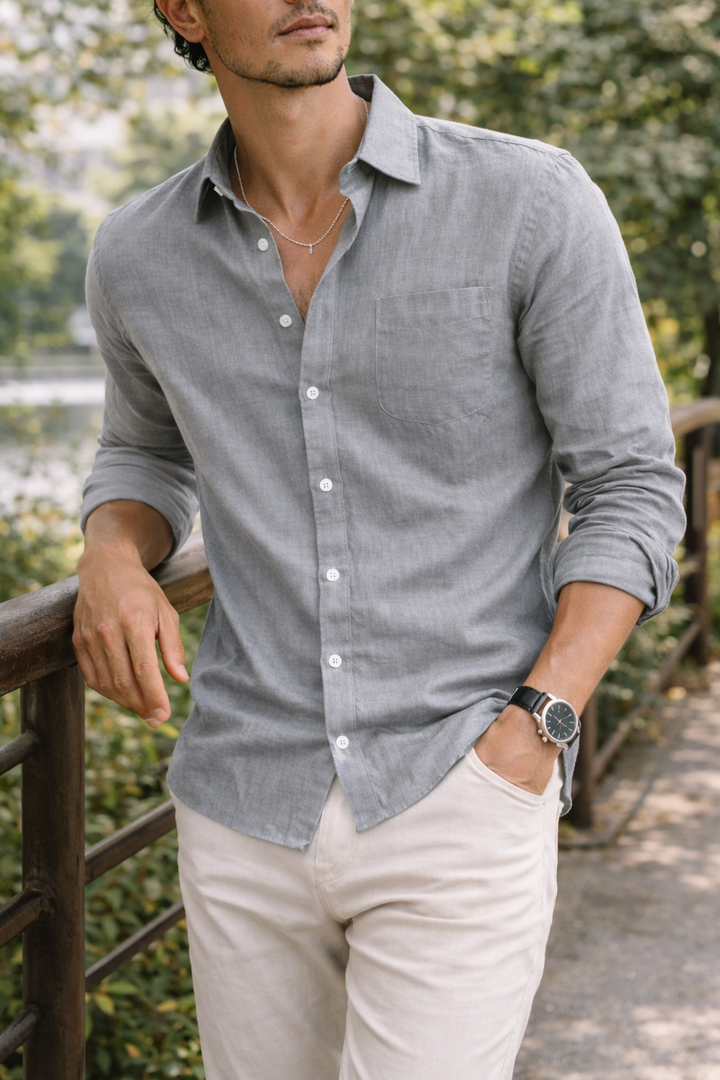 Classic collar button-down men's navy blue long sleeve shirt. Versatile smart casual top for everyday wear.