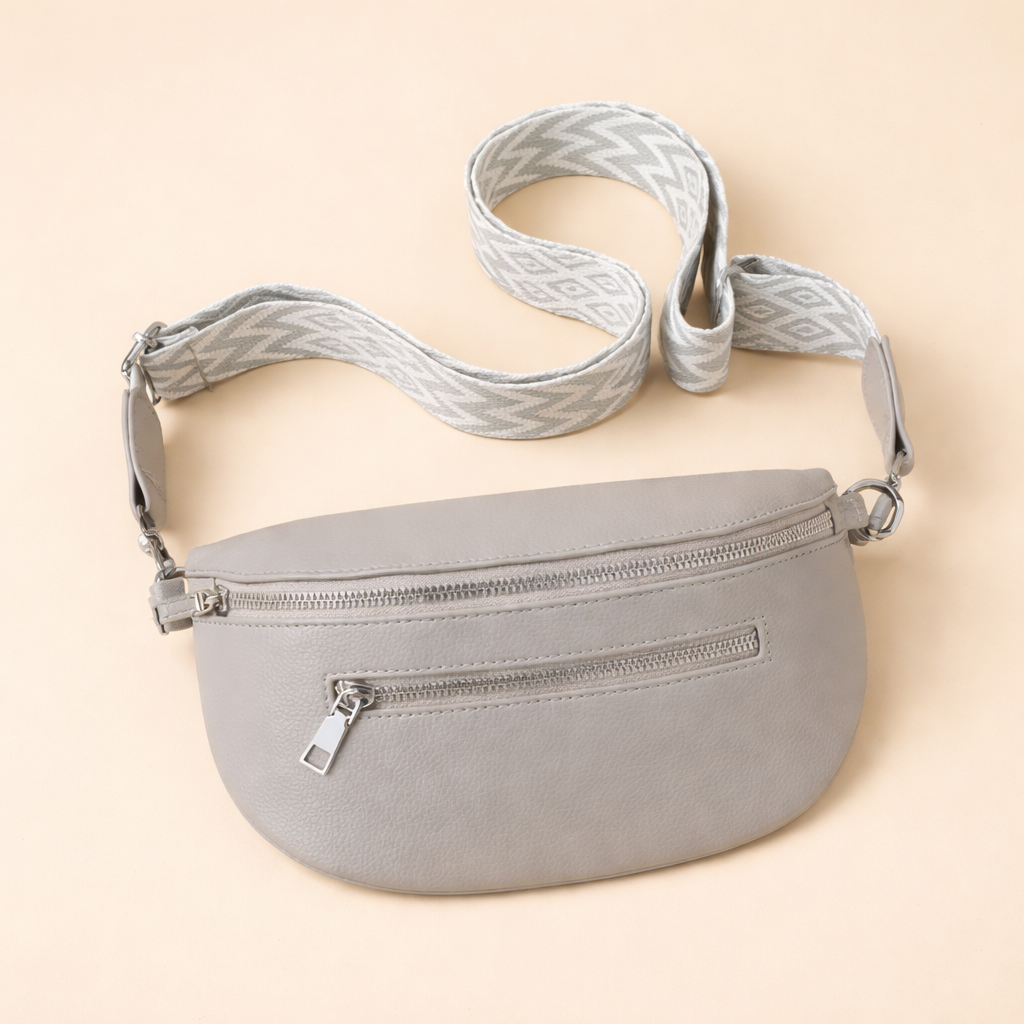 Black minimalist crossbody belt bag for women, offering a modern, chic look for travel & daily errands.