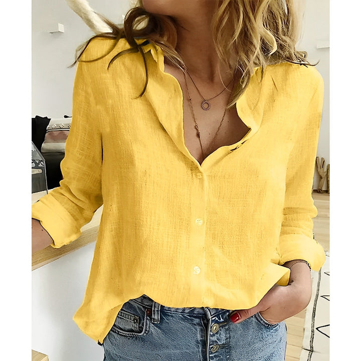 Classic women's button-up shirt, a relaxed fit long-sleeve blouse offering elegant everyday & workwear style.