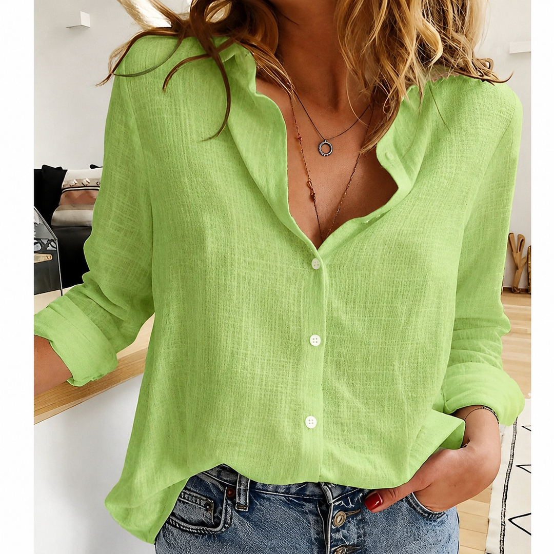 Versatile women's relaxed fit button-up top, an elegant long-sleeve blouse for comfortable chic fashion.