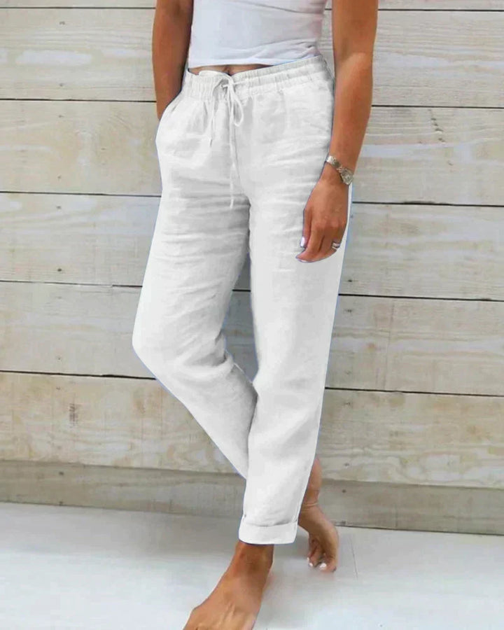 Versatile women's relaxed fit linen trousers for summer. Comfortable & breathable for casual or smart-casual wear.