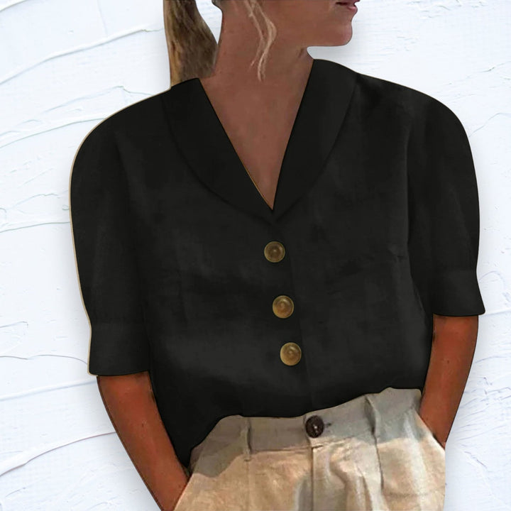 Versatile women's V-neck cap sleeve blouse with a relaxed fit for everyday comfort and style.