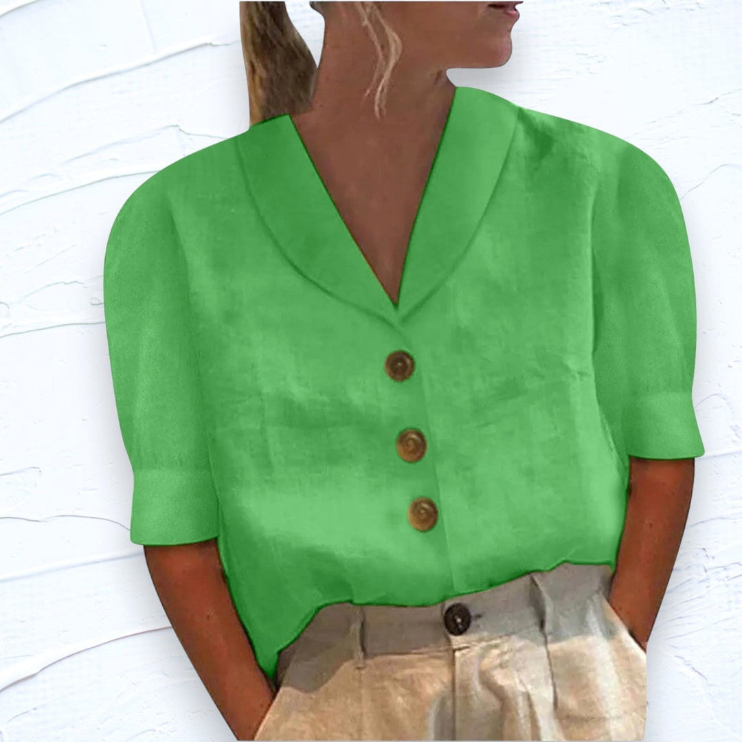 Chic women's V-neck blouse with subtle button details and cap sleeves, a versatile top for any season.