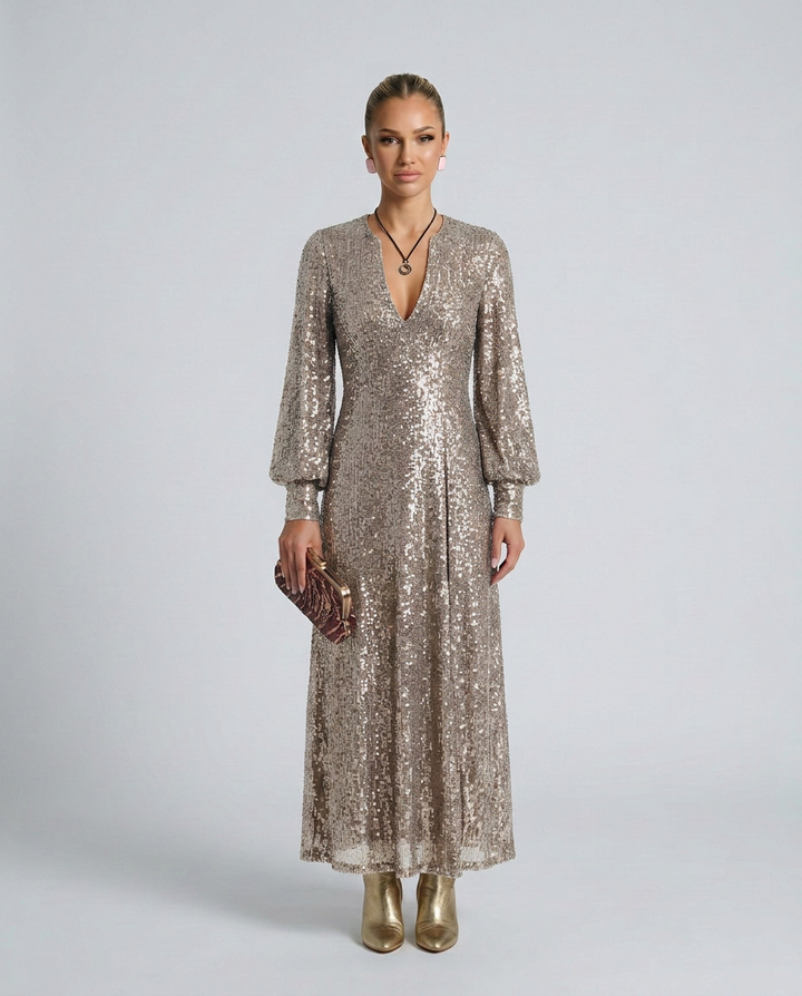 Women's glamorous sequin V-neck maxi party dress. A dazzling long sleeve evening gown for special events.
