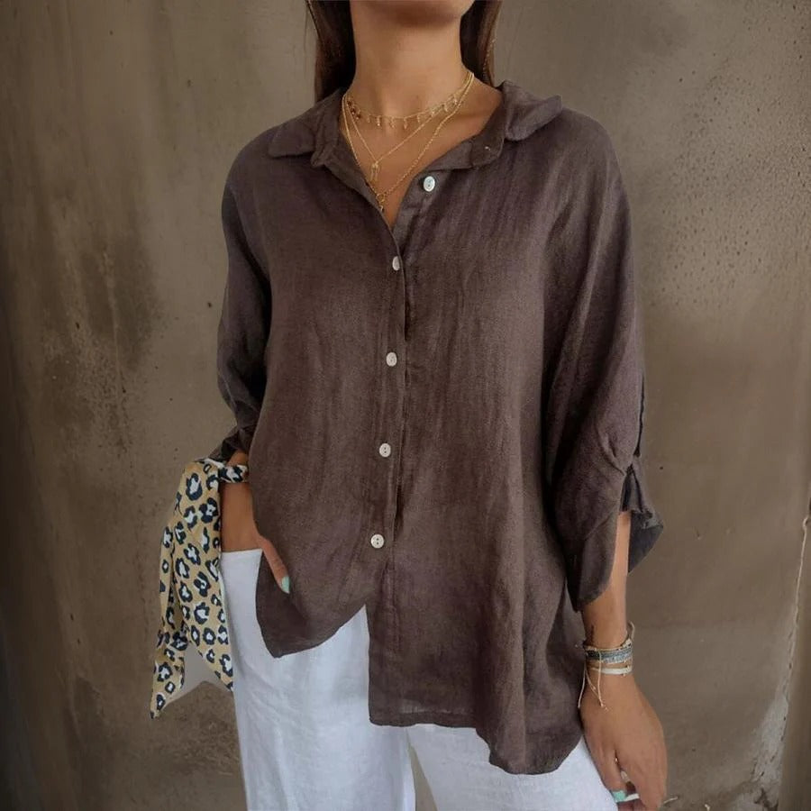 Women's sophisticated relaxed fit linen button-down shirt with rolled sleeves for summer casual wear.