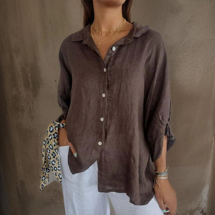 Women's sophisticated relaxed fit linen button-down shirt with rolled sleeves for summer casual wear.