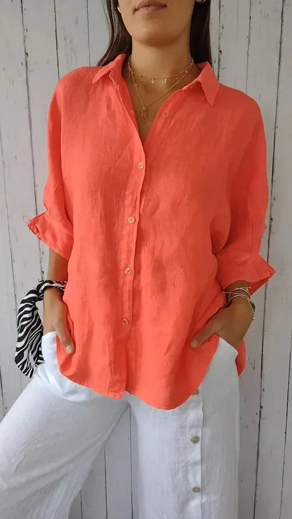 Chic women's oversized linen shirt with rolled sleeves, a comfortable relaxed fit, and classic button-down style.