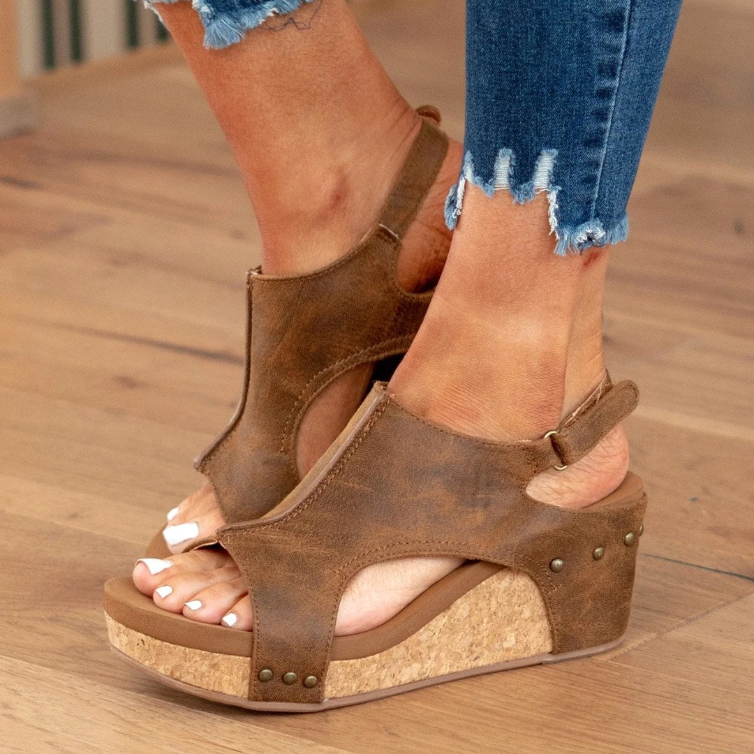 Stylish women's comfortable wedge sandals. Open-toe summer footwear, perfect for elegant casual or dressy event wear.