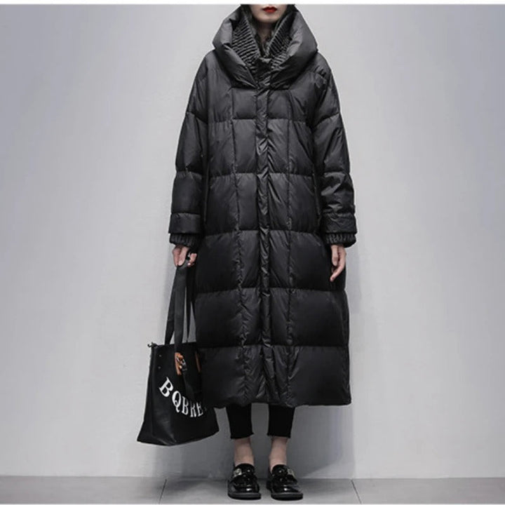 Amara women's long padded winter jacket. Warm, cozy, & stylish outerwear for cold weather fashion.
