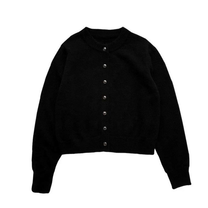 Loose knit round neck women's cardigan in a light color, perfect for effortless spring layering.