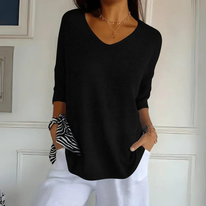 Classic women's knit shirt, a sophisticated must-have top. Comfortable & stylish for all occasions.
