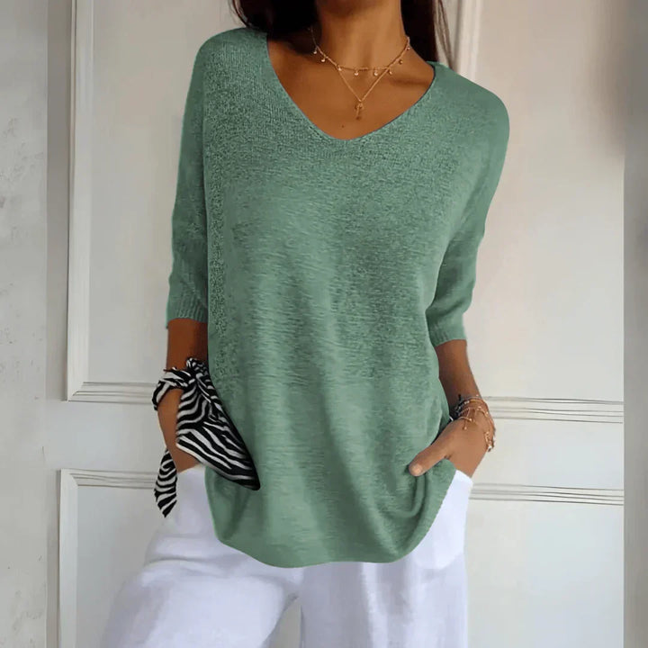 Elegant women's knit shirt in a sophisticated design. A classic fashion piece for any women's wardrobe.
