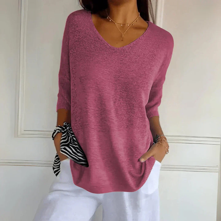 Stylish women's knit top for a modern casual look. Soft knit shirt, comfortable for daily wear.