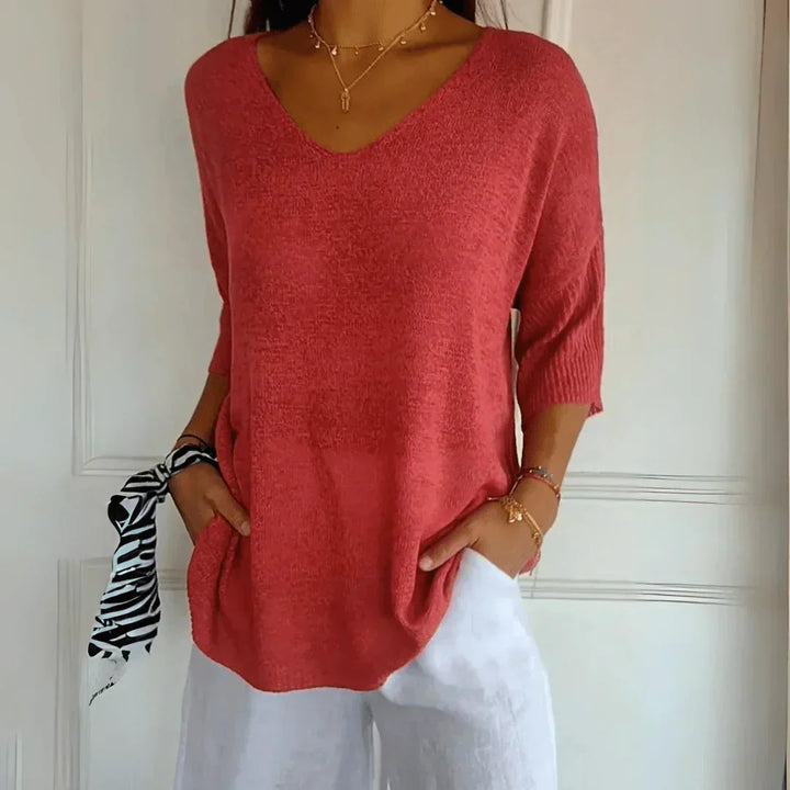 Sophisticated women's knit shirt, perfect for elegant casual wear. Comfortable & stylish everyday top.