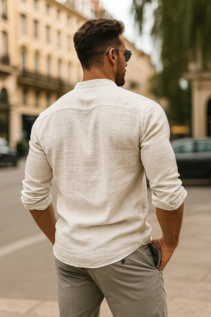 Relaxed long sleeve men's shirt featuring a grandad collar & button-up front. Ideal for casual warm weather style.