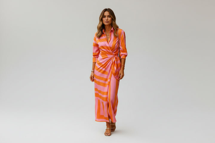 Elegant women's wrap collar summer dress in a vibrant color, offering comfortable & flattering fit for spring.