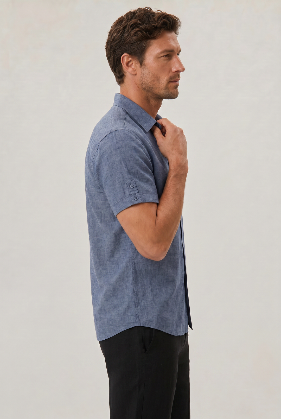 Close-up of a men's stylish textured short sleeve shirt, highlighting fabric detail for a modern look.