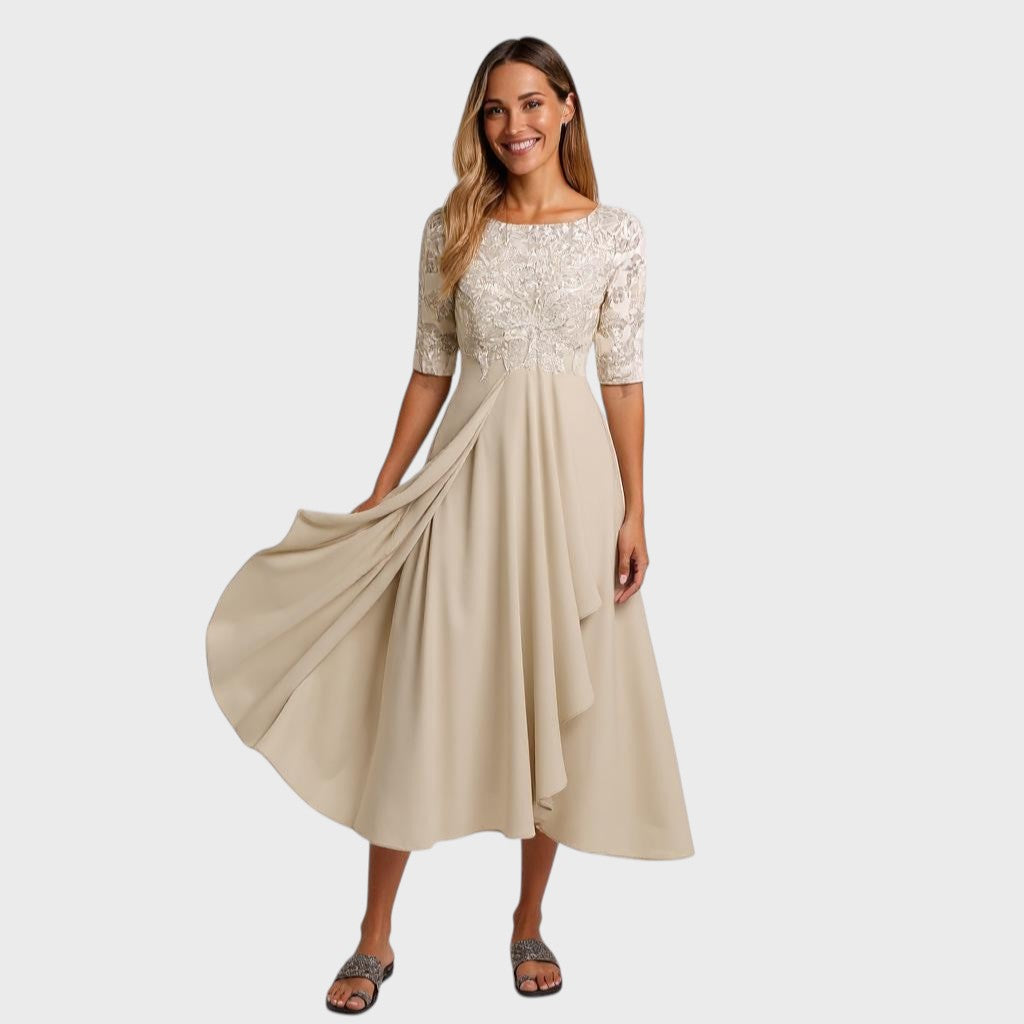 Elegant women's embroidered dress with a flowing draped skirt, perfect for race day or formal events.
