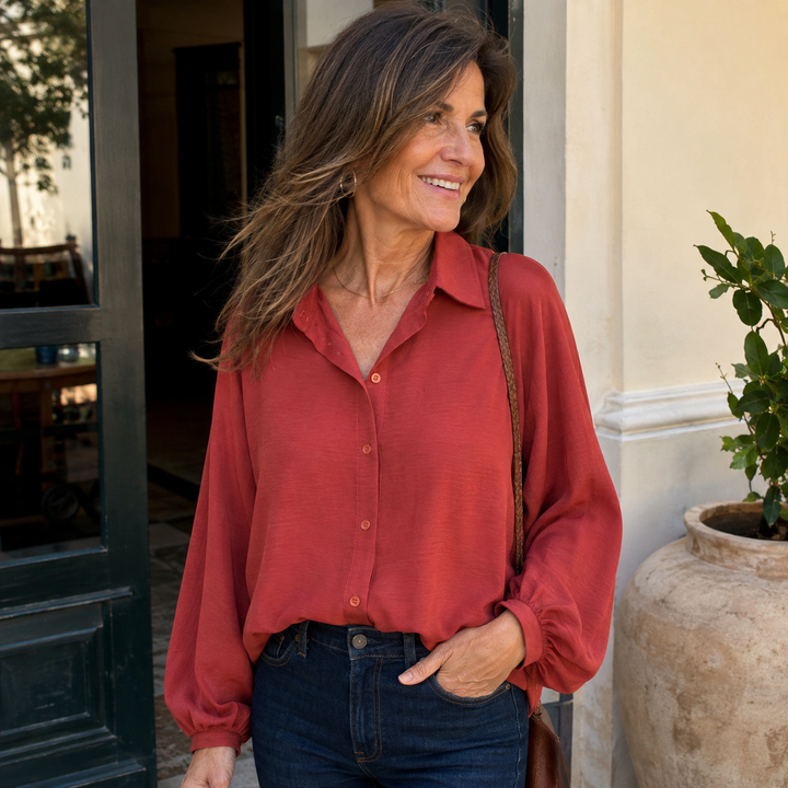 Women's stylish relaxed fit button-down blouse with long billowy sleeves, perfect for casual everyday wear.