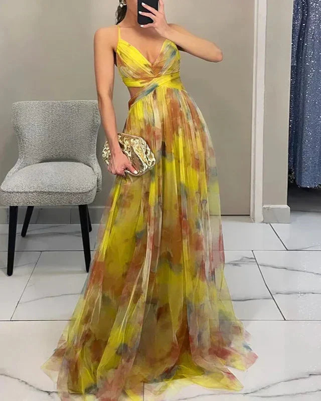 Boho chic women's maxi dress with a vivid watercolor print, A-line silhouette, and spaghetti straps.