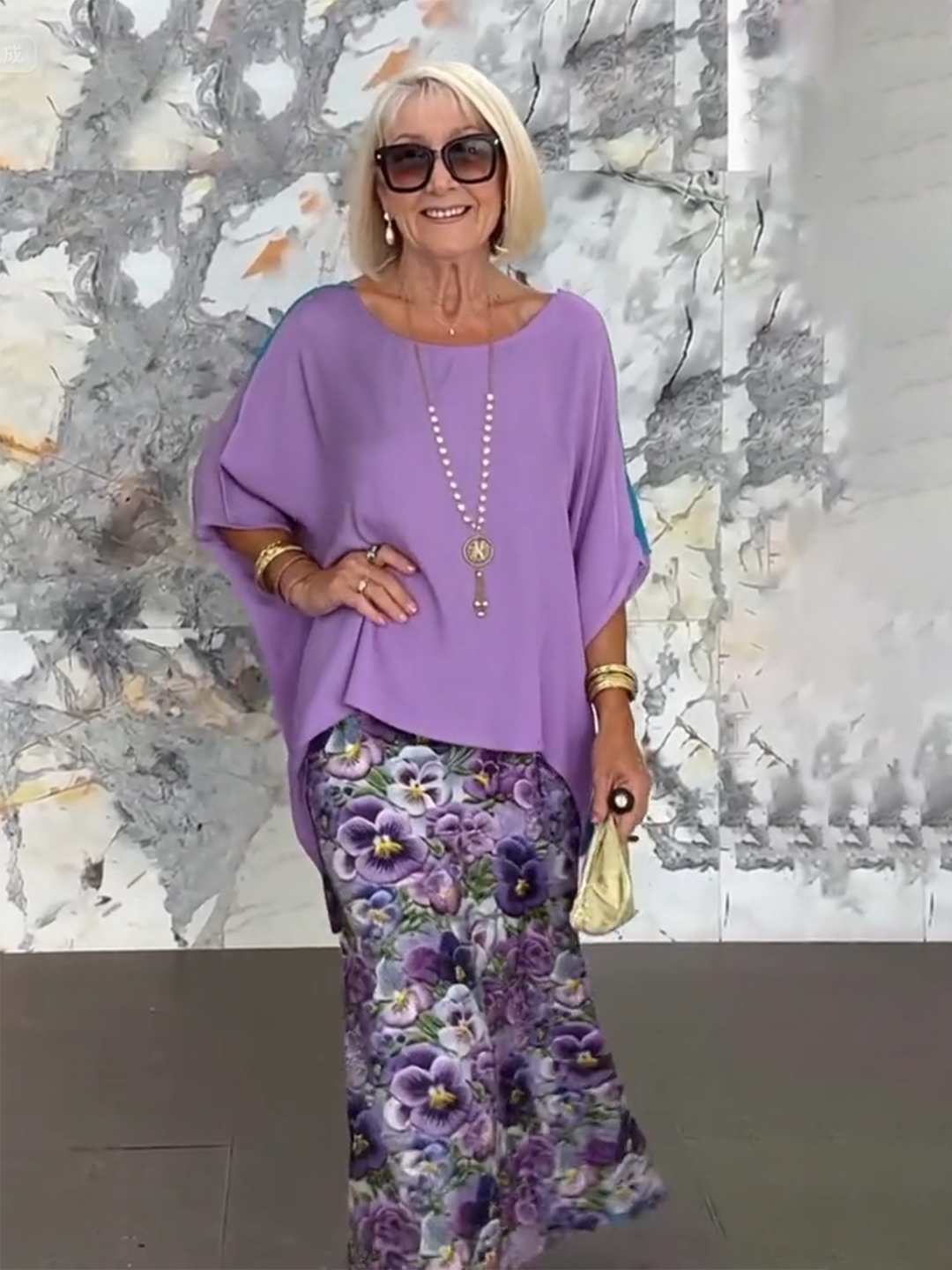 Modern women's tiered ruffle maxi dress with stylish batwing sleeves.
