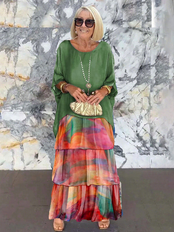 Women's occasion wear: stylish tiered ruffle cocktail dress with batwing sleeves.