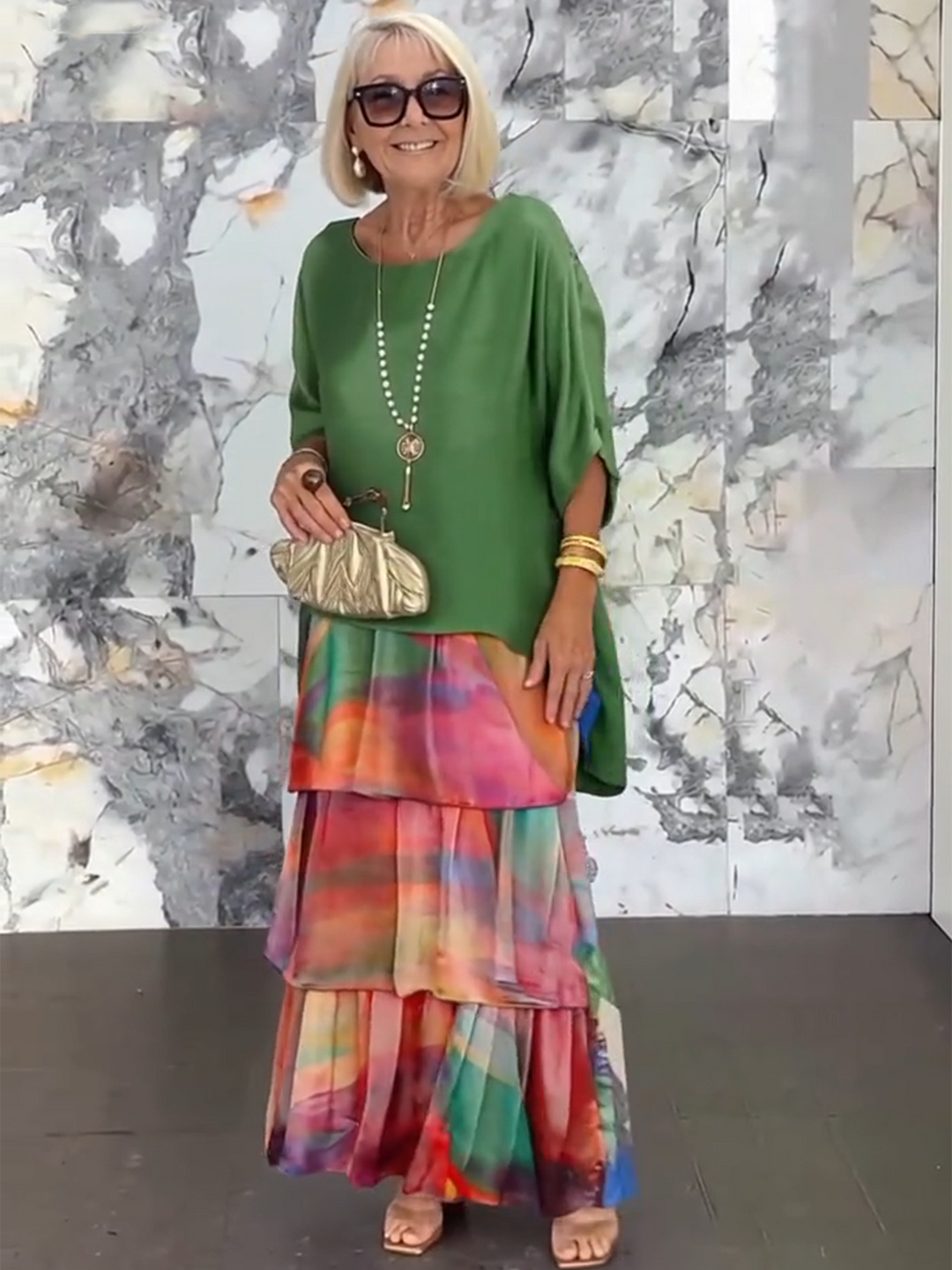 Flowing silhouette women's tiered ruffle dress, unique batwing sleeves for evening.