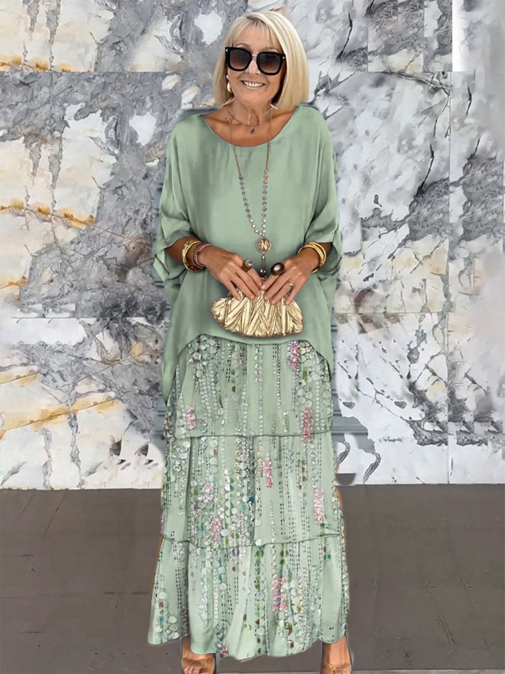 Stylish women's maxi cocktail dress with flowing tiered ruffles & batwing sleeves.