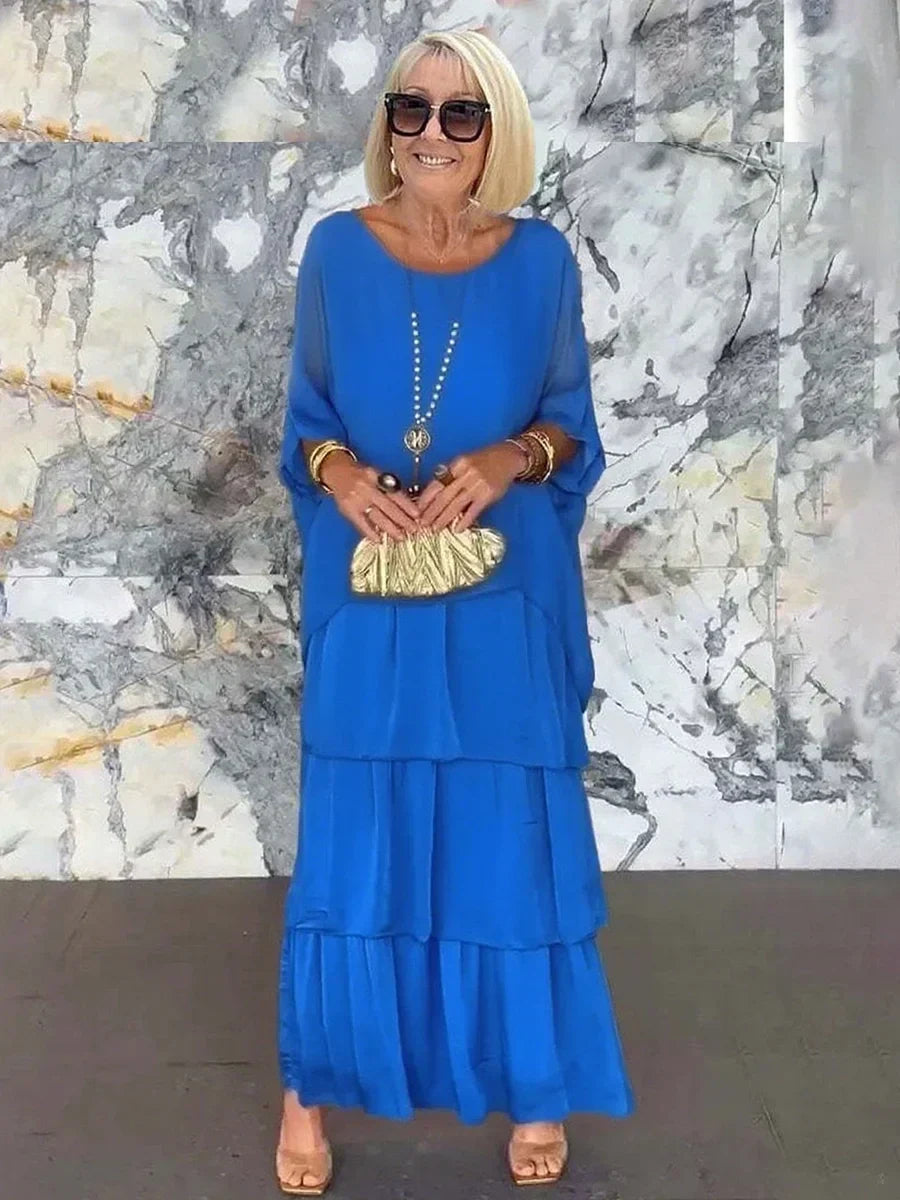 Stylish women's party wear: tiered ruffle batwing sleeve maxi dress design.