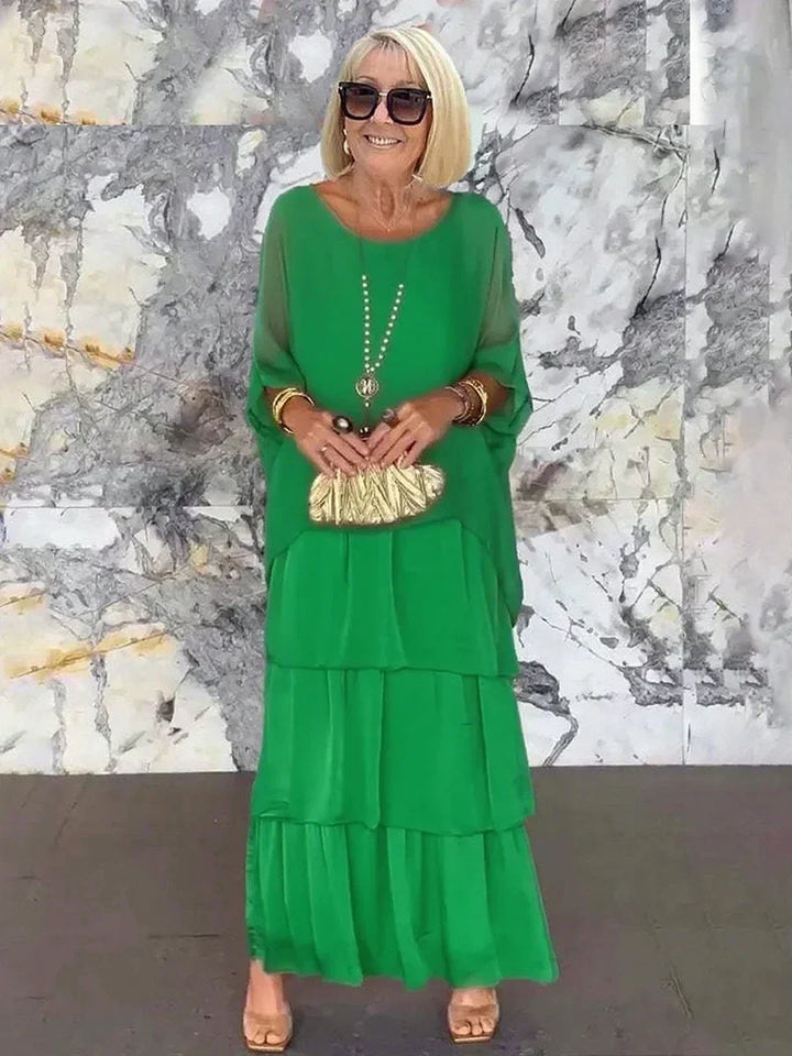 Beautiful women's tiered ruffle batwing sleeve cocktail dress, flowing and elegant.