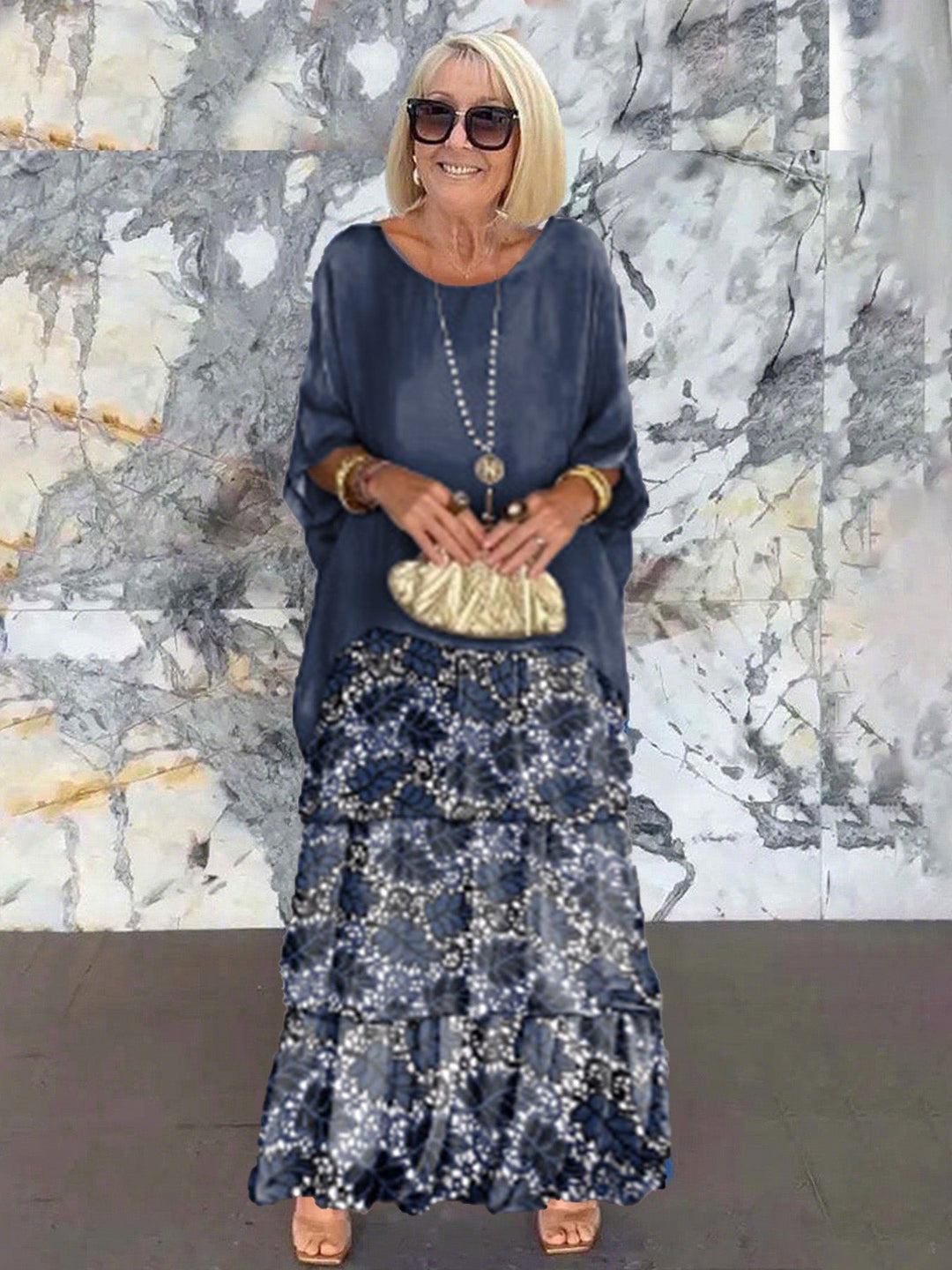Sophisticated women's evening gown: tiered ruffles, batwing sleeves, perfect for events.