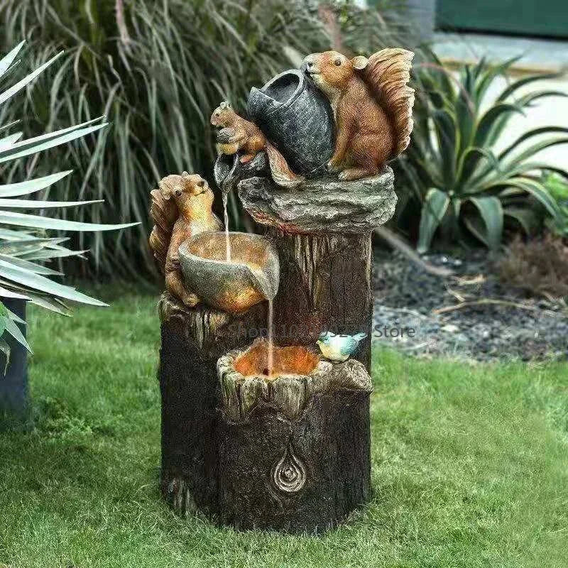 Decorative outdoor solar fountain featuring a detailed squirrel figure & LED light. Durable resin garden & patio decor.