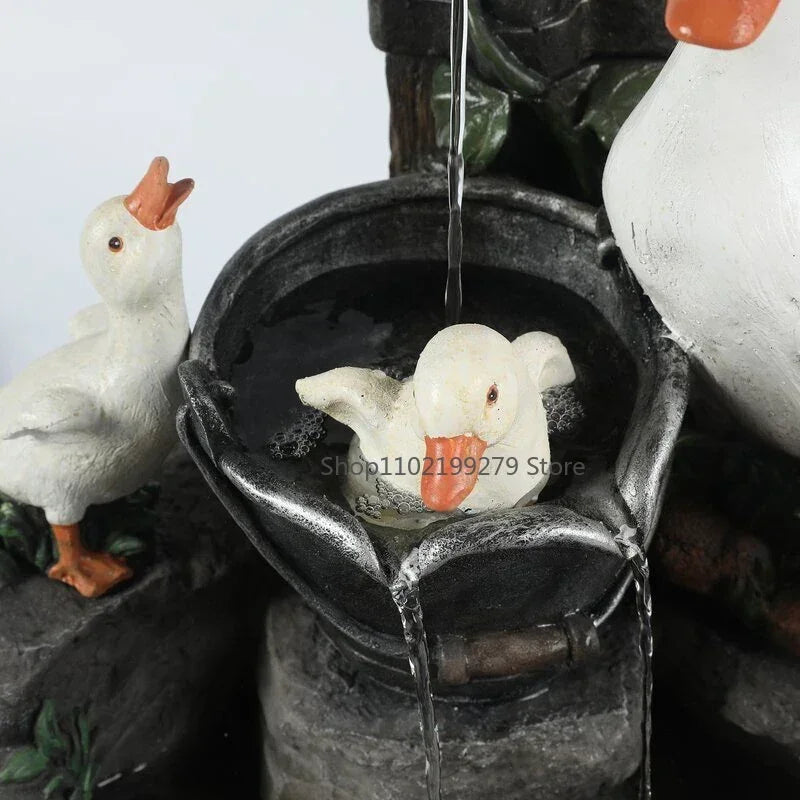 Whimsical duck/squirrel solar fountain with LED light. Perfect weatherproof resin garden statue, water feature & decor.
