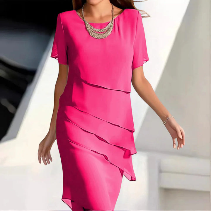 Versatile women's green midi dress with a flattering silhouette, ideal for summer parties & elegant events.