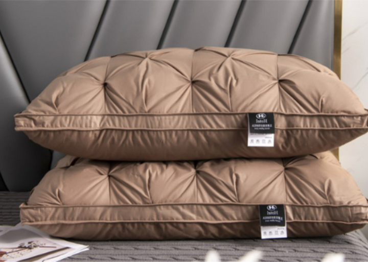 Soft and breathable down pillow for a luxurious and comfortable night's sleep.