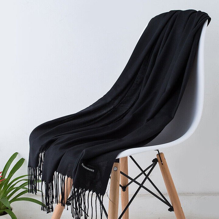 Luxurious long cashmere scarf for women, soft and warm winter fashion accessory.