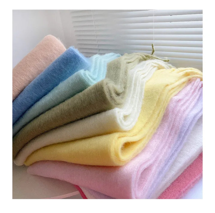 Plush, soft Eloise cashmere scarf, a luxury winter fashion accessory for women.